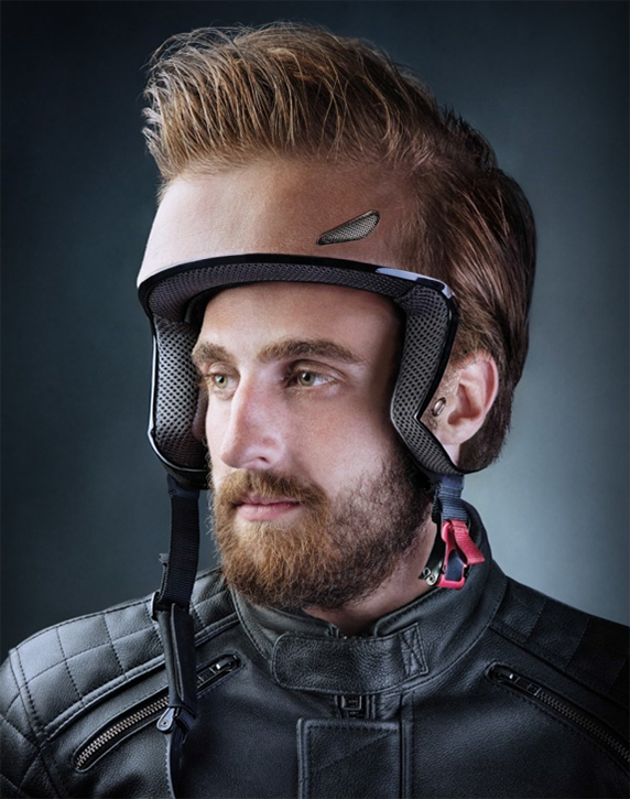 Man wearing skin-toned motorcycle helmet