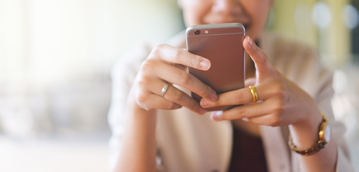 Image of woman with her cell phone