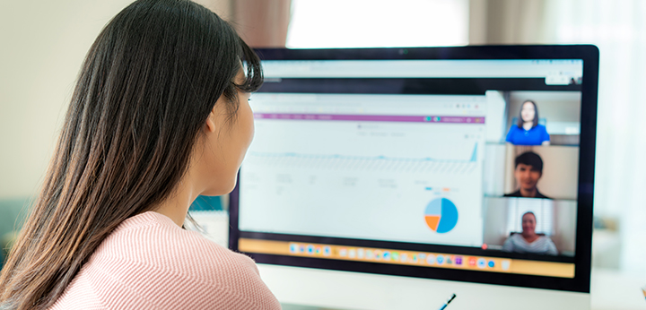 Woman attending a videoconference with colleagues