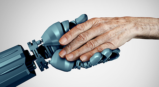 A robot arm holds an elder’s hand.